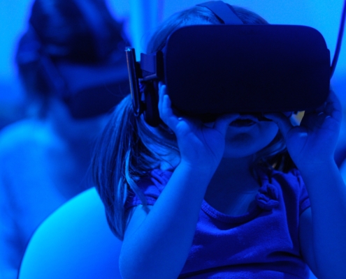girl using VR goggles