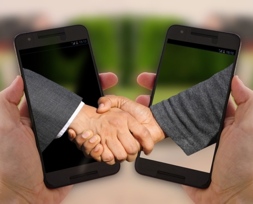 smart Contracts digitale Verträge shaking hands, handshake, arrangement