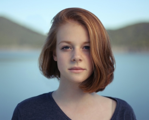 shallow focus photography of woman outdoor during day