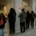 A group of people standing outside of a bakery