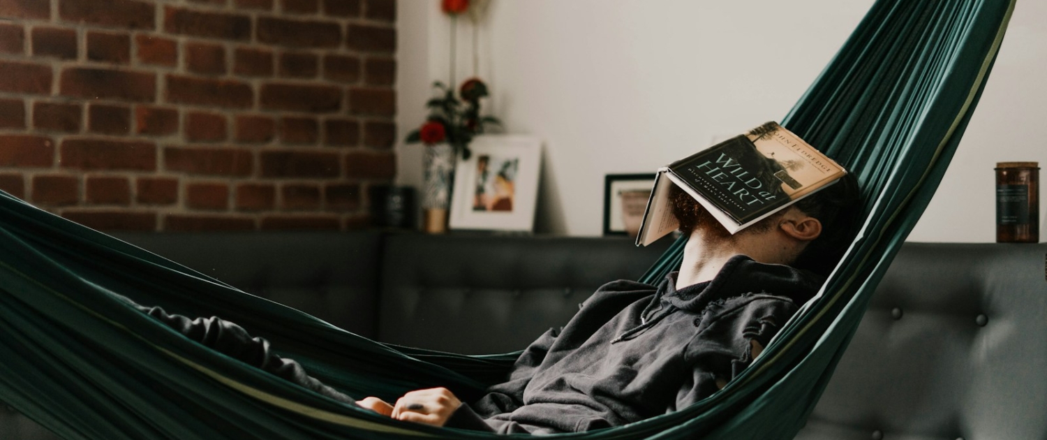 woman in black hijab reading book